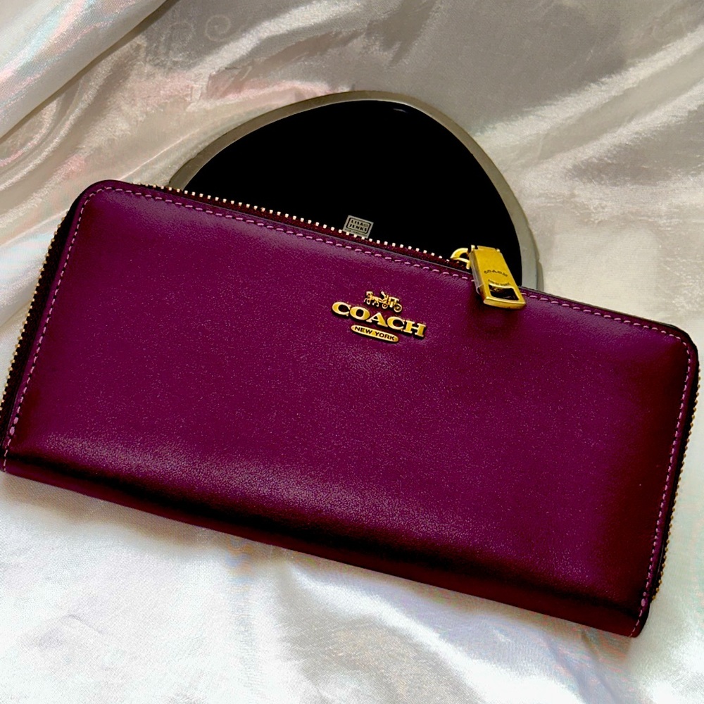 Coach burgundy, leather wallet, lots of slots in it
